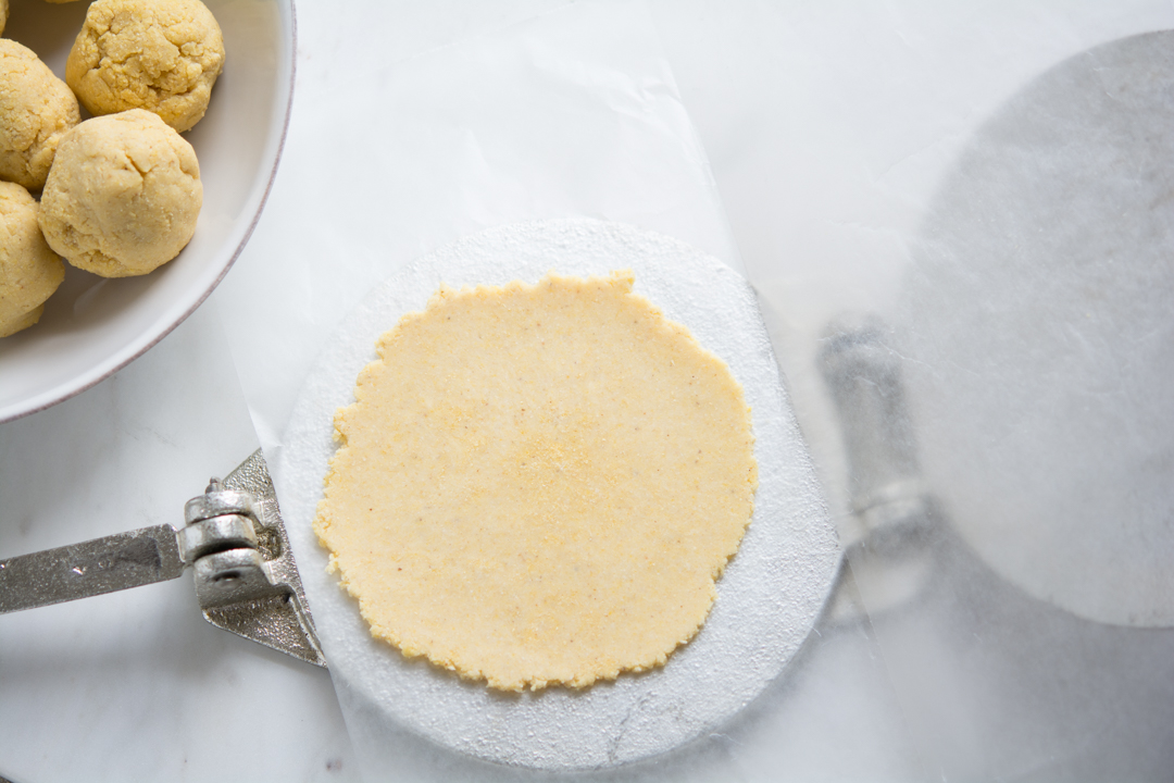 Flattend out tortilla on the tortilla press