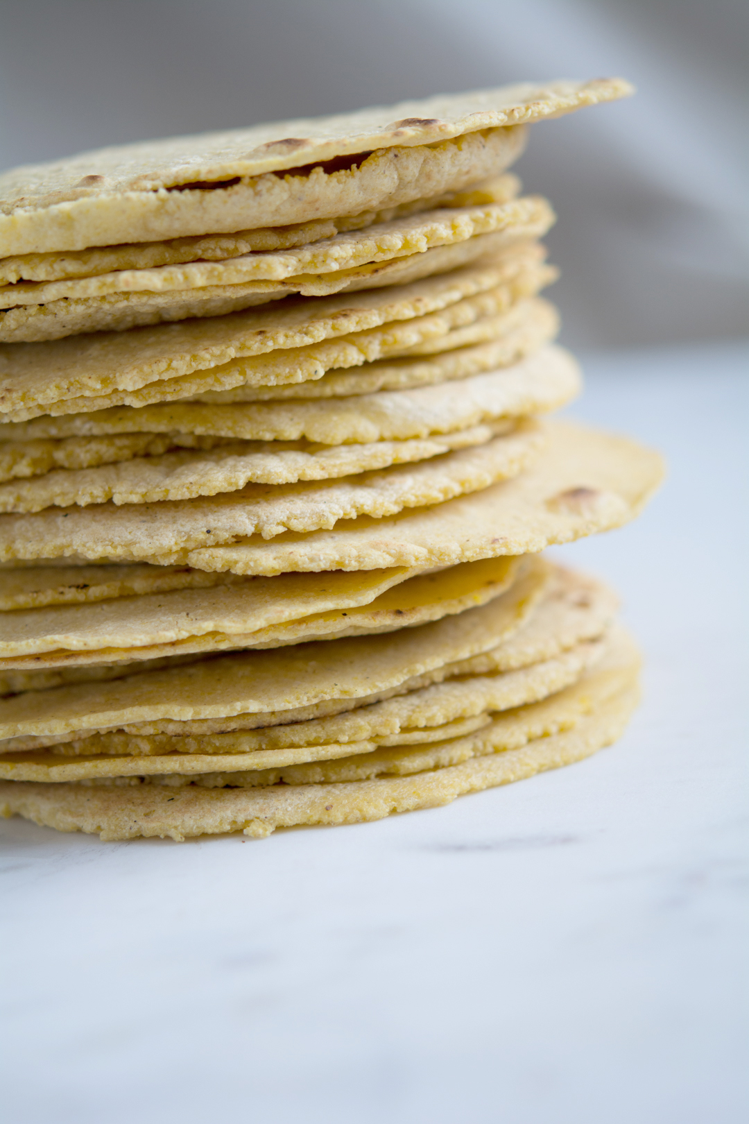 a stack of homemade tortillas, sideview 