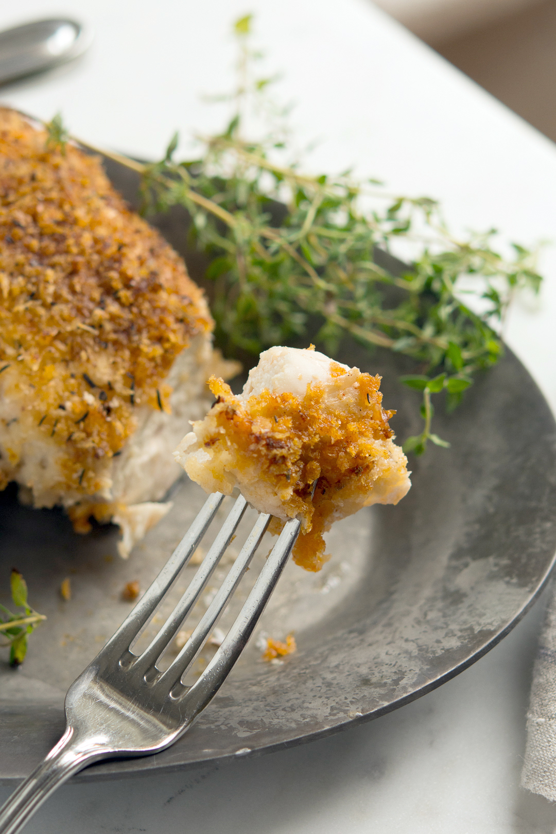 Piece of oven-fried picnic chicken on plate