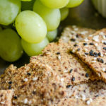 almond crackers closeup with green grapes