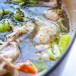 Homemade Chicken Stock in a cast iron pot