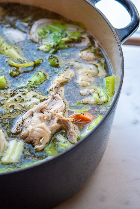 Homemade Chicken Stock in an enamel coated cast iron pot