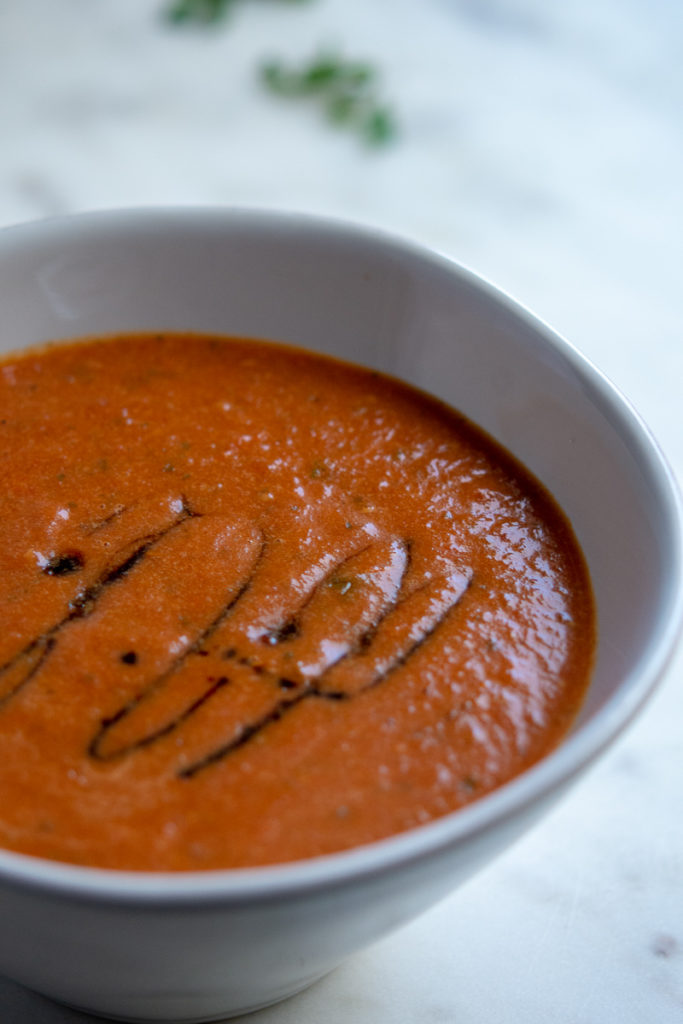 roasted tomato soup in a bowl with balsamic vinegar drizzle