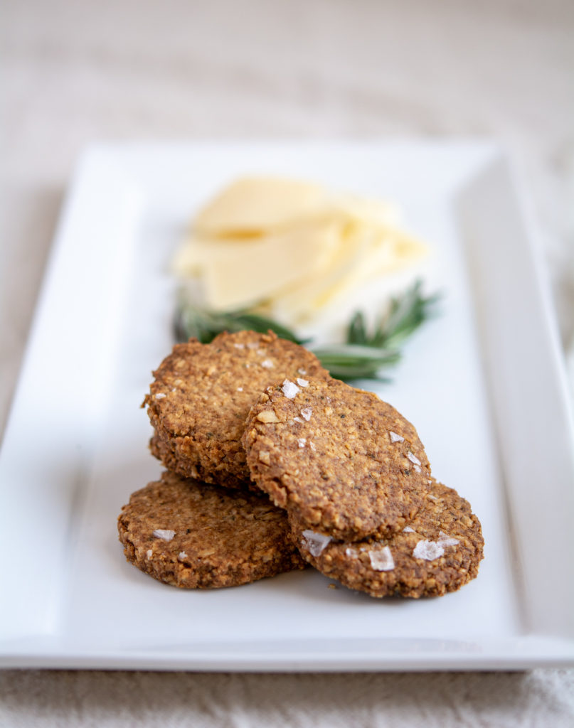 photo of rosemary oat crackers on a white platter