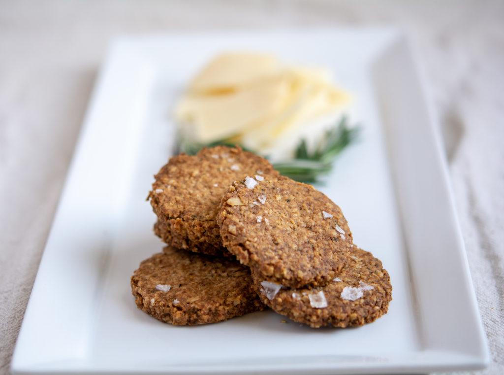 photo of rosemary oat crackers on a white platter