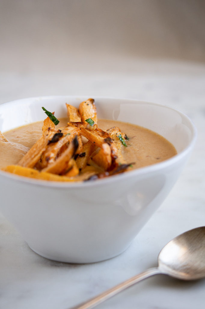 Photo of rutabaga and chipotle soup with rutabaga fries on top