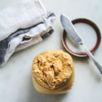 Overhead photo of fresh double roasted peanut butter in a mason jar