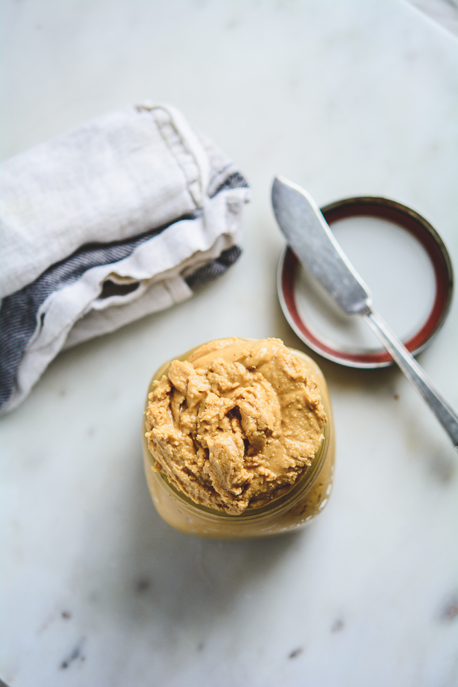 Overhead photo of fresh double roasted peanut butter in a mason jar