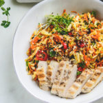 Overhead shot of plated Chicken Cabbage Carrot Salad in focus