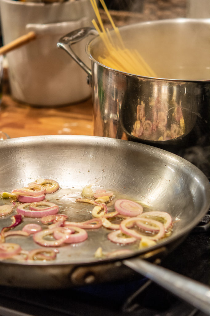 shallots sautéing in a pan