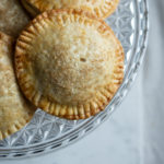 Pumpkin Hand Pies closeup on fancy glass cake plate