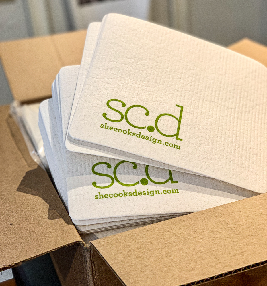 photo of shecooks.design branded dishcloths in delivery box