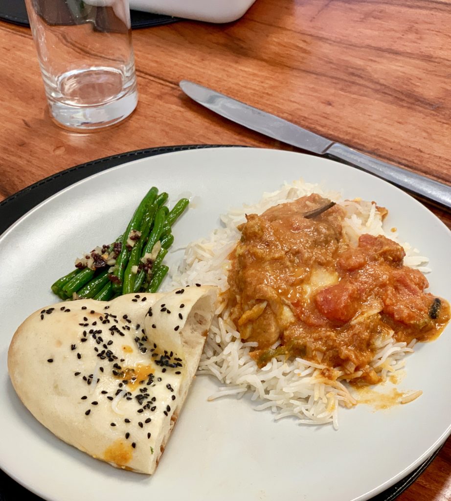 Photo of naan, green beans and chicken curry