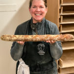 Shelagh holding a freshly baked bagette