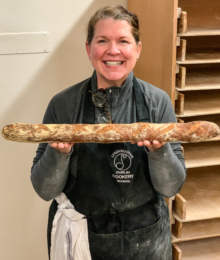 Shelagh holding a freshly baked bagette