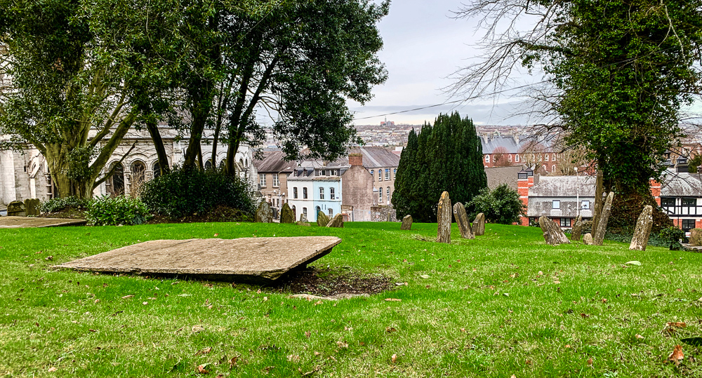 photo of grave with cork city in the background