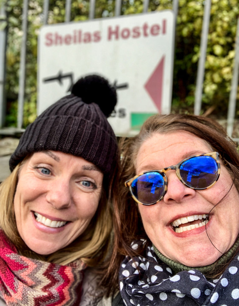 Two Sheila/Shelagh's in front of Sheila's Hostel.