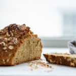 Loaf of irish soda bread with a slice