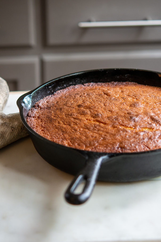 Pineapple Upside-Down Cake in a cast iron pan, right out of the oven