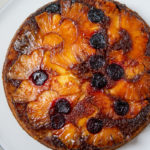 Overhead close up photo of Pineapple Upside-Down Cake on cake plate