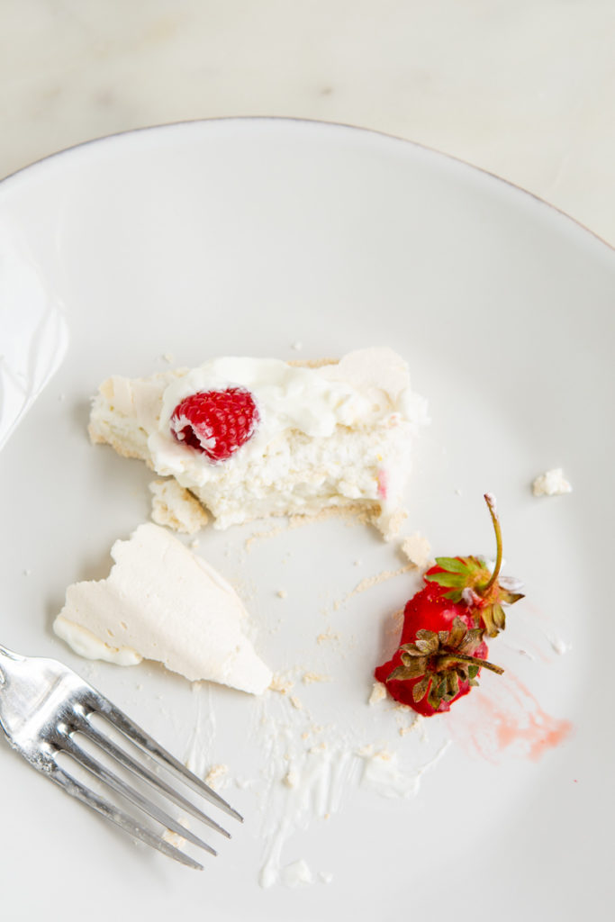 eaten pavlova cake with berry stems