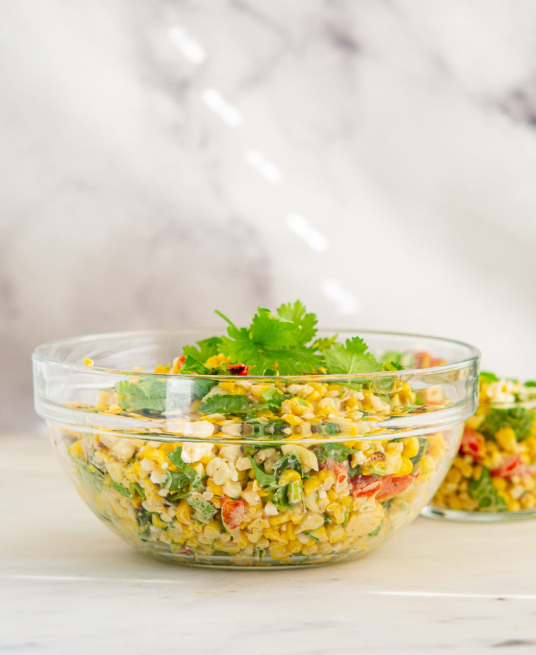 Large glass bowl of Grilled Elote Corn Salad