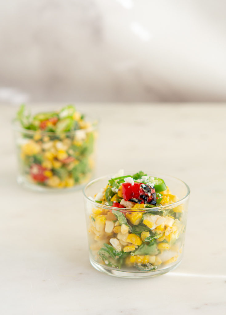 Grilled Elote Corn Salad in a small glass dish