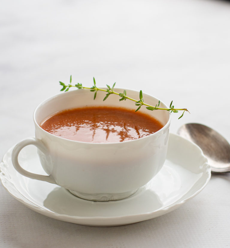 Grilled Gazpacho in a dainty cup, backlit