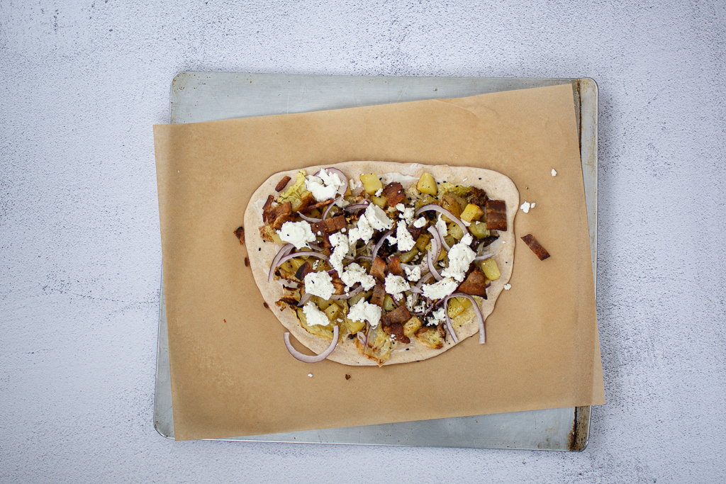 overhead shot of prepared, unbaked Shelagh's Irish Pizza