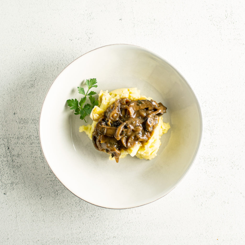 plated bowl of bangers and mash