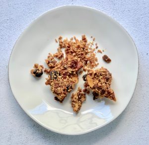 overhead shot of crumbled granola bars on a plate