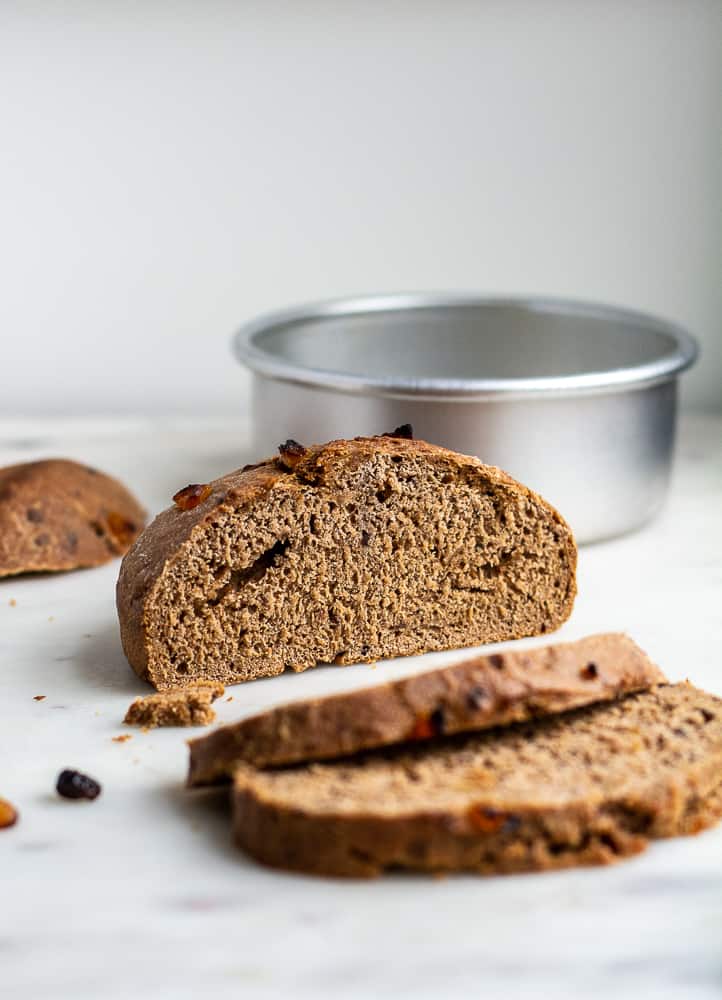 Sliced barmbrack bread with pan in the background