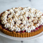 slight overhead view of cranberry tart on a cake stand