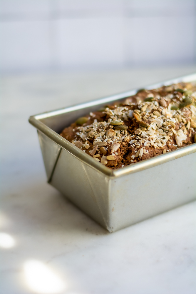 Seedy Irish Brown Bread in bread pan, close up