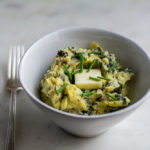 close up of colcannon in a bowl with a fork