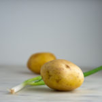 yukon gold potato and a green onion