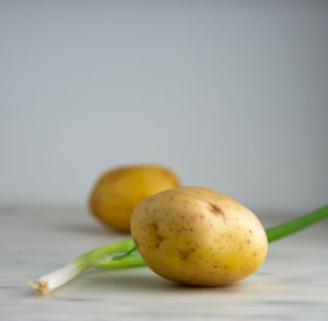 yukon gold potato and a green onion