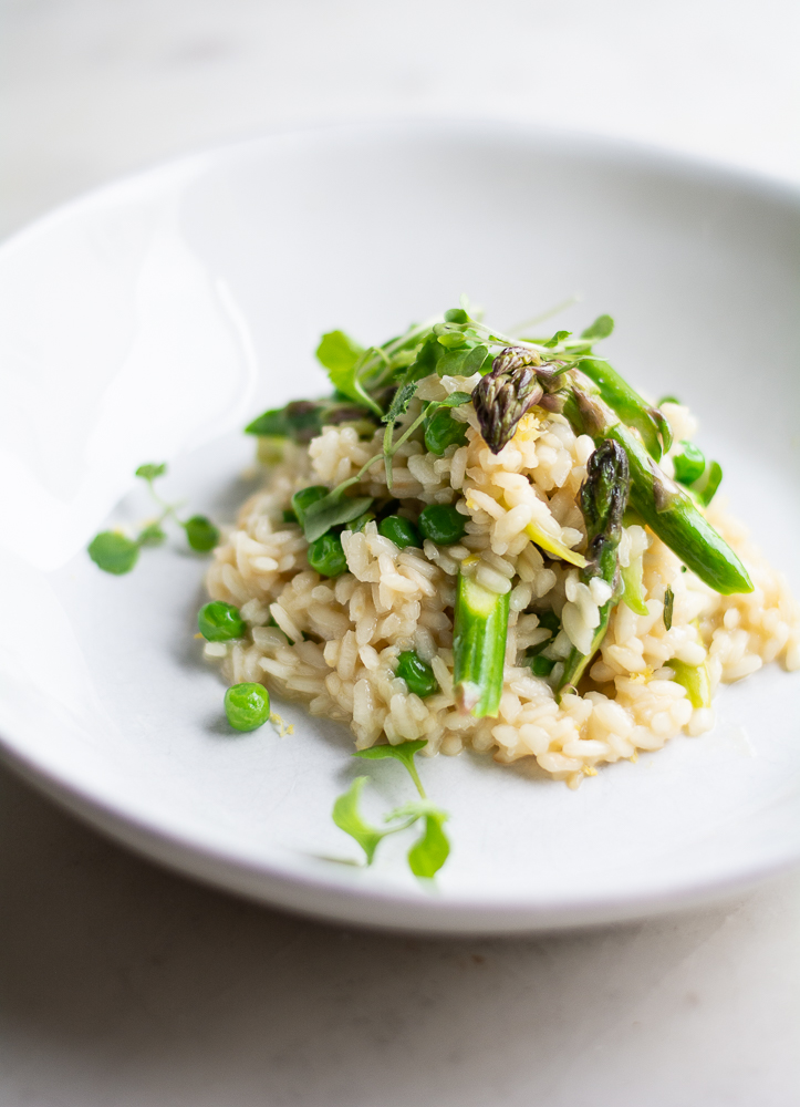 close up shot of spring risotto in a shallow dish