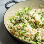 close up of spring risotto in a black pan