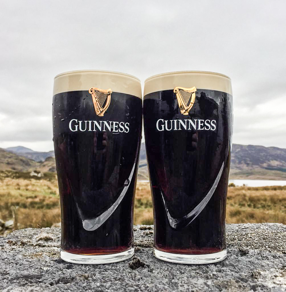 two guinness on a rock