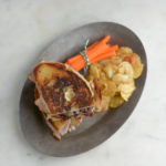 overhead shot of Anne's cheese toastie with some carrots and chips