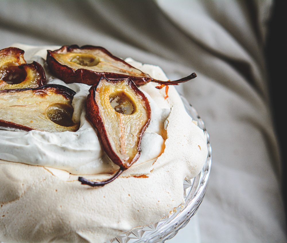 Moody shot of Roasted Pear Pavlova on a pretty platter