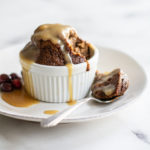 photo of sticky toffee pudding, caramel sauce and a spoon