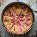 overhead shot of rhubarb cake in a springform pan