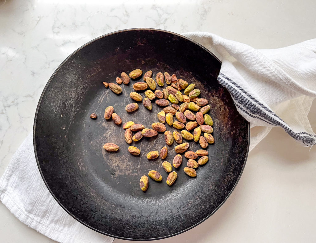 toasted pistachios in a pan