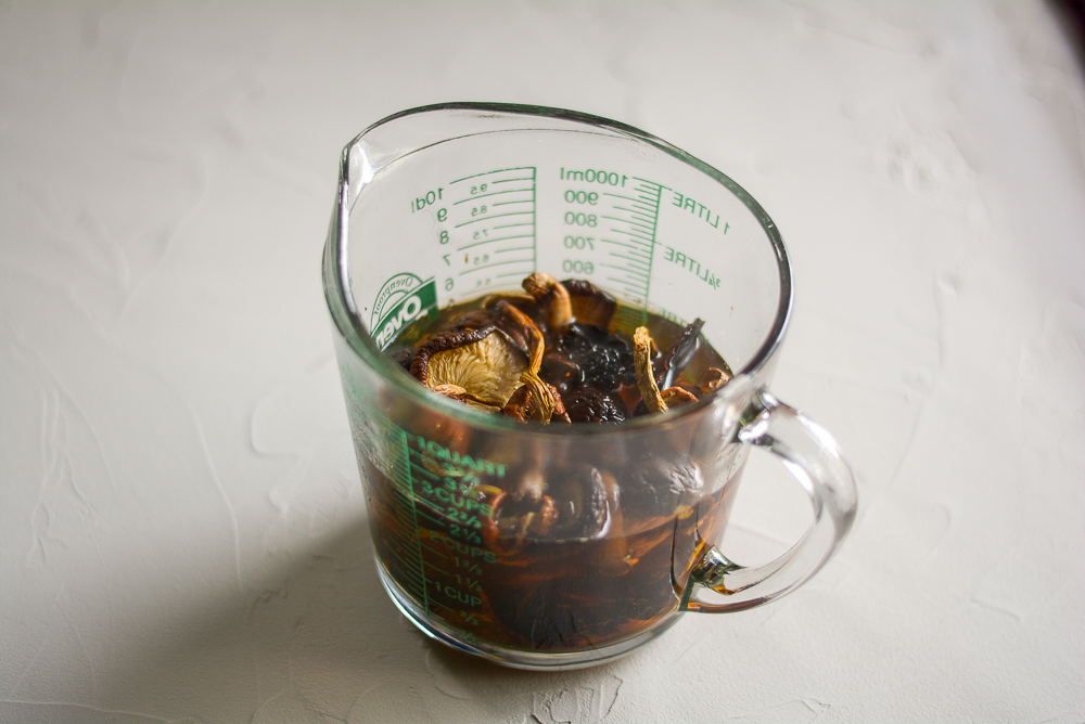 Rehydrating mushrooms in water in a measuring jug