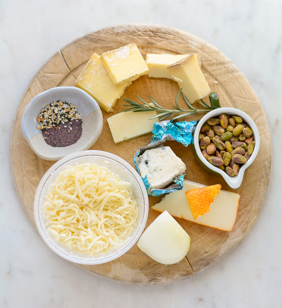 ingredients for a cheeseball. pistachios, cheese, onion