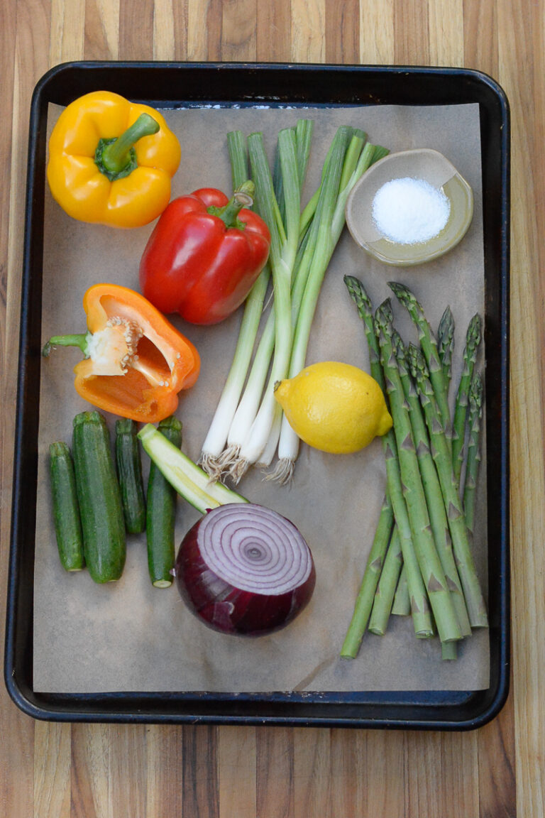 raw veggies on a tray for Charred Garden Vegetables with Herb Dressing recipe