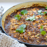 Close up of Summer Veg and Bean Enchilada Bake photo in pan