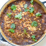 Top down shot of Summer Veg and Bean Enchilada Bake photo in pan